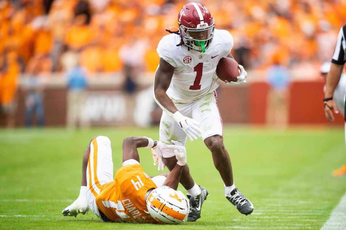 Alabama running back Jahmyr Gibbs (1) runs past Tennessee defensive back Christian Charles (14) during Tennessee's game against Alabama in Neyland Stadium in Knoxville, Tenn., on Saturday, Oct. 15, 2022.